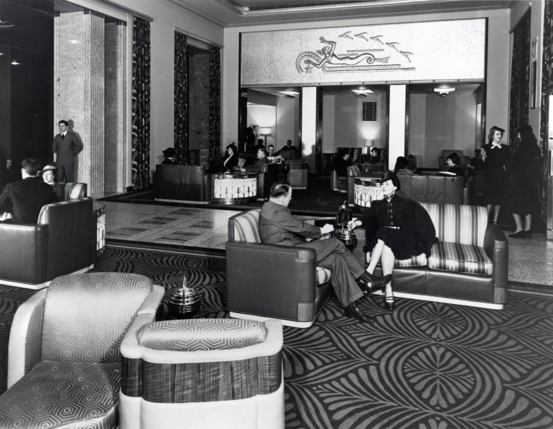 Guests sitting in Hotel Vancouver's art moderne lobby design in 1939