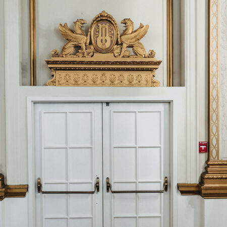 Doors in the Pacific Ballroom with a sculpture of two griffins above