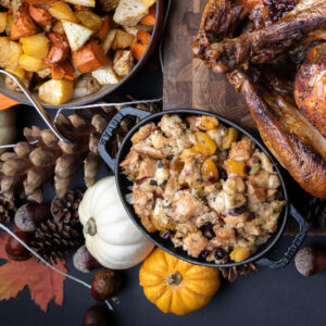 Bread stuffing in a Staub dish with fall accompaniments