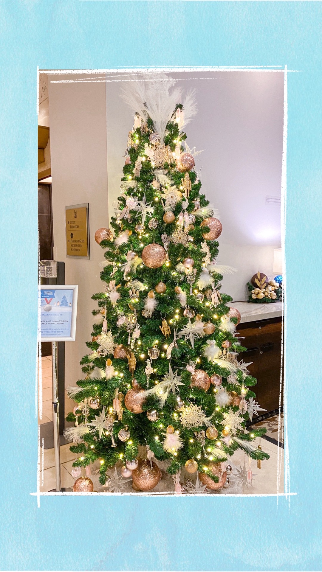 A holiday tree decorated with pink, gold, and silver ornaments for the BCCHF Festival of Trees