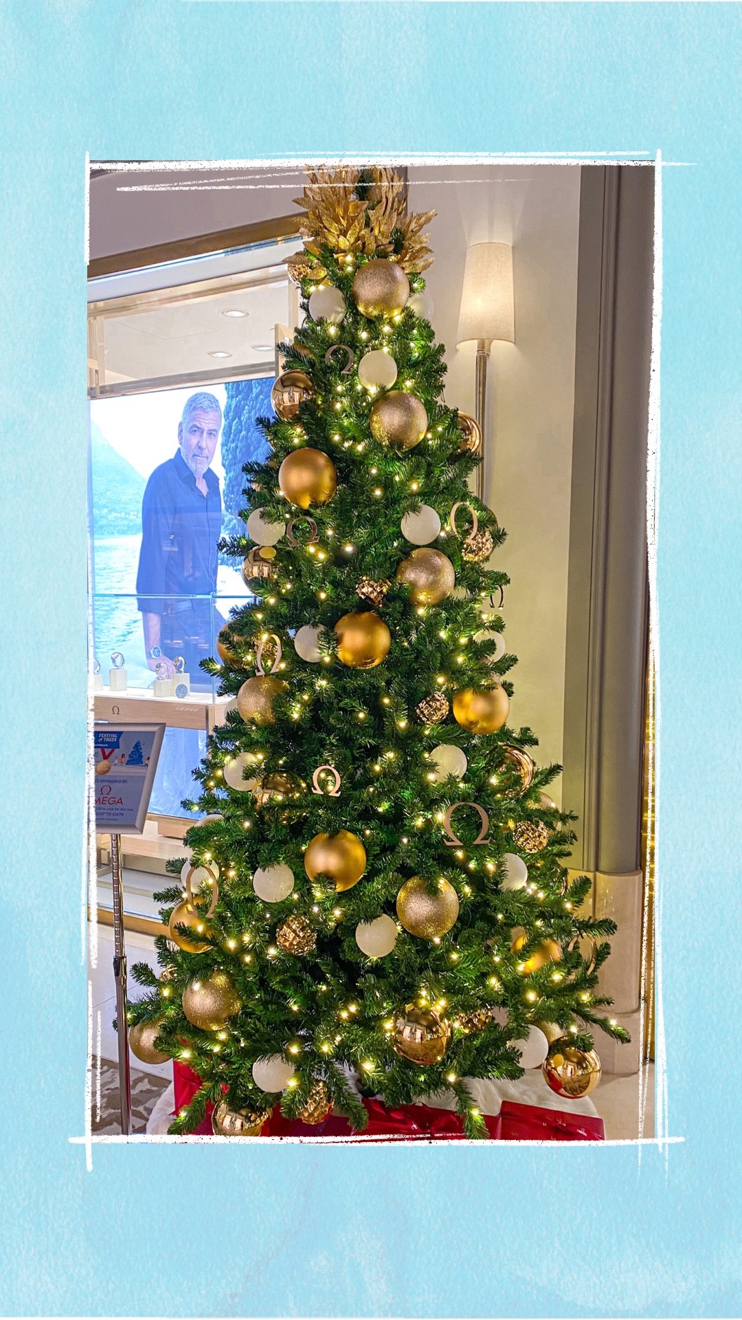 A holiday tree decorated with gold ornaments for the BCCHF Festival of Trees