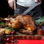 A holiday turkey being carved.