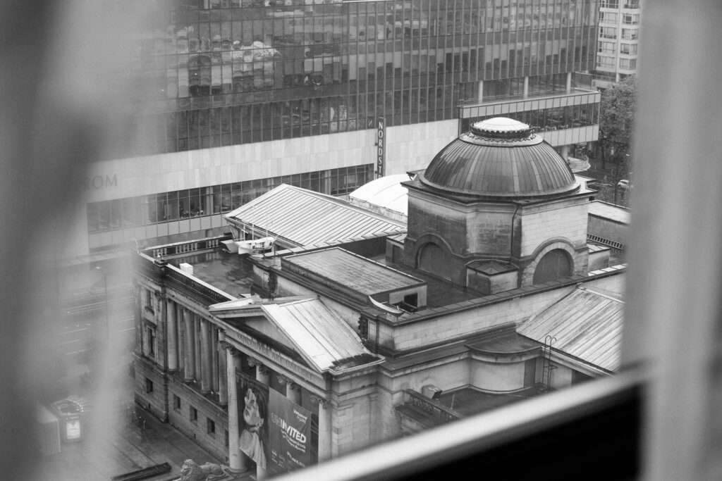 A black and white photo from a window looking down at the Vancouver Art Gallery.